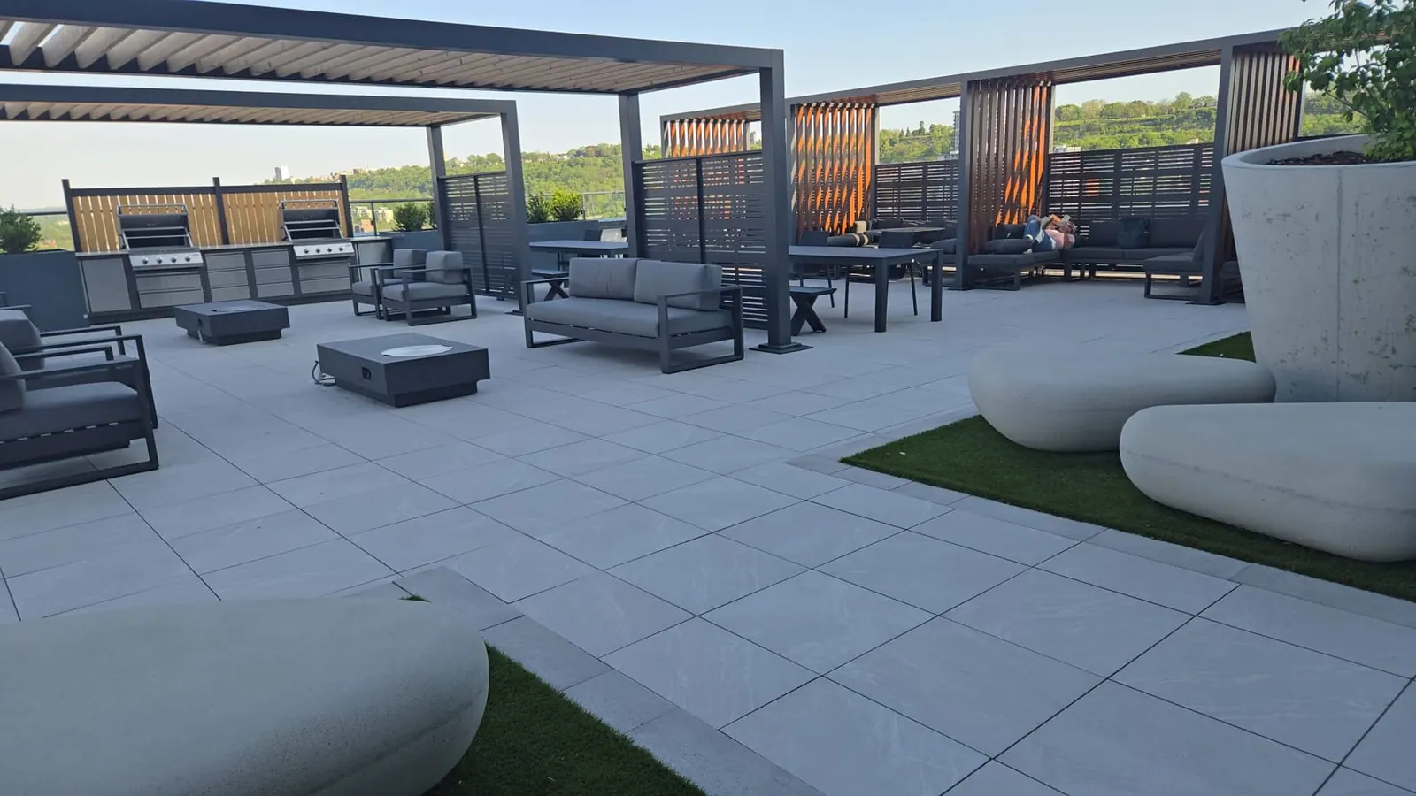 Overview of the rooftop terrace with lounge seating and open space to gather